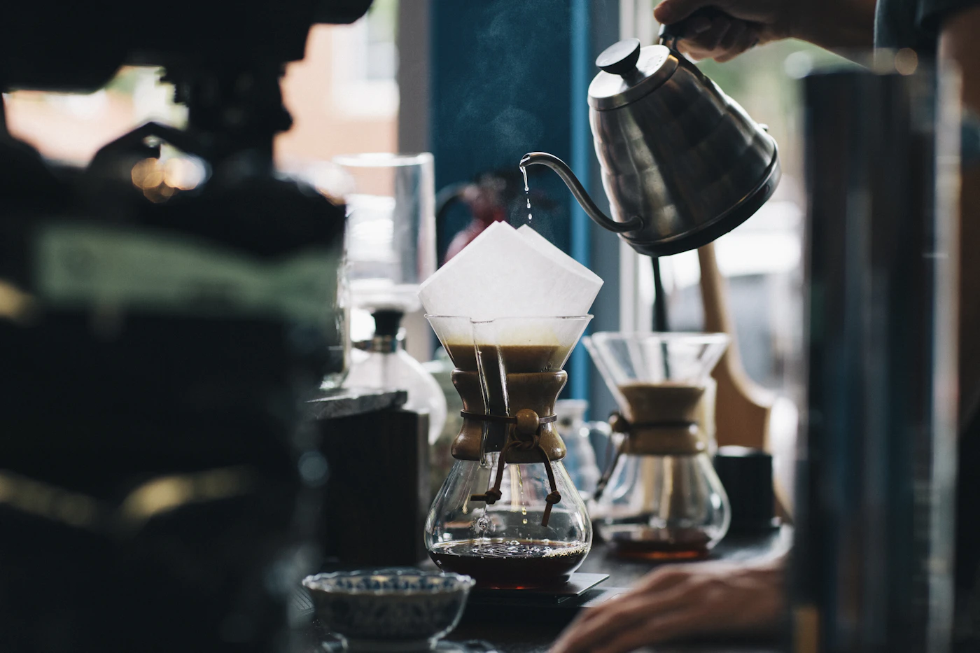 Coffee being prepared at a café counter