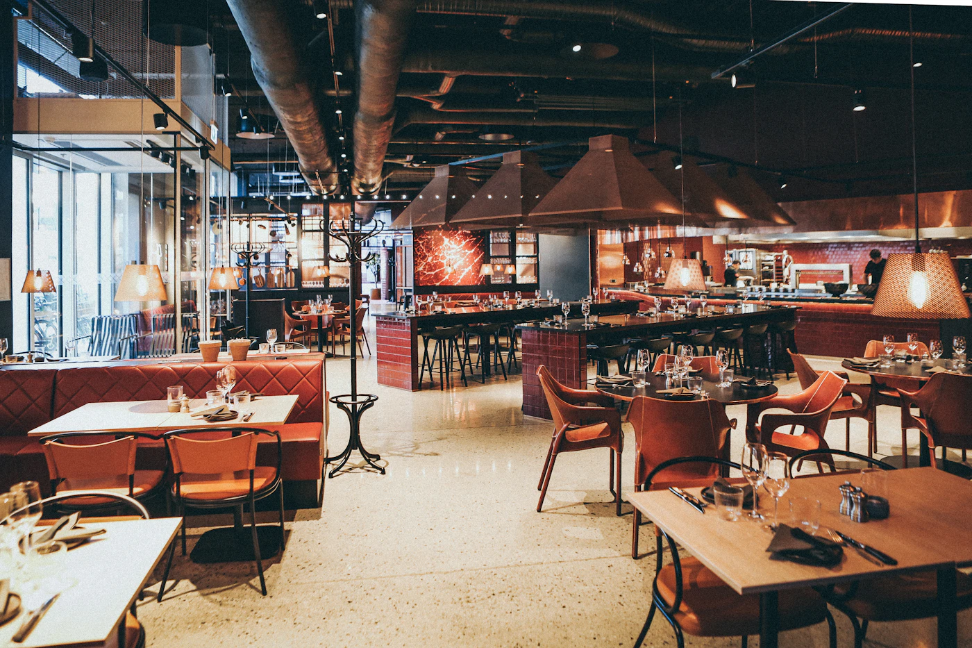 A restaurant with seating arranged for diners